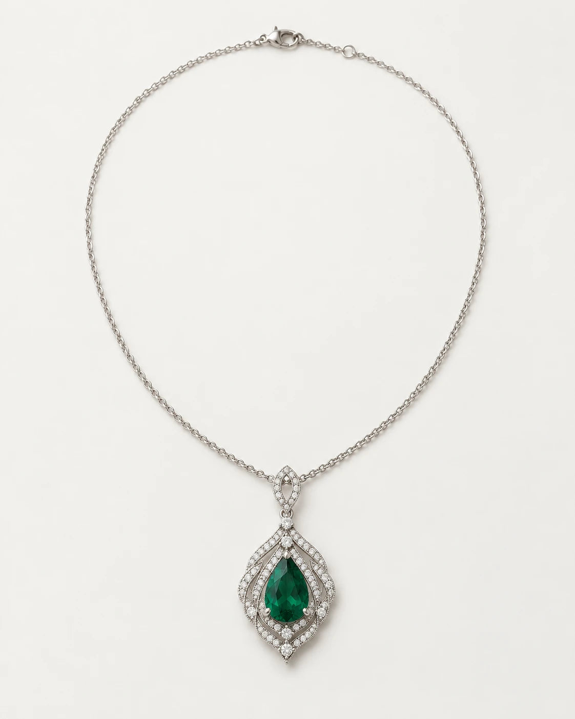 Verdant Lace Pendant. Pear center within an openwork frame.