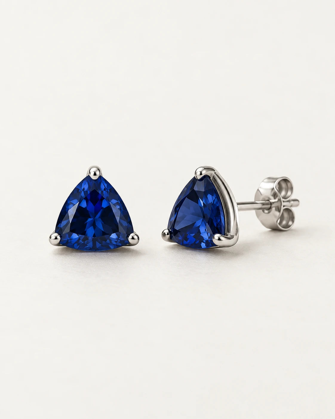 Deep blue triangular stud earring concepts